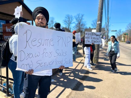 More than 200 foreign workers protest in front of P.E.I.’s Office of Immigration on Euston Street on May 13 against recent changes to the province’s immigration policy. Thinh Nguyen • The Guardian