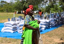 A villager arrives to collect her monthly allocations of food aid provided by the World Food Program (WFP) in Mumijo, Buhera district east of the capital Harare, Zimbabwe, March 16, 2024.