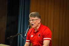 Gardiner MacDougall speaks during a news conference at the Aitken Centre in Fredericton on May 14. MacDougall, from Bedeque, P.E.I., officially retired as UNB men’s hockey head coach after 24 years during the news conference. Evan Richtsfeld/UNB Athletics