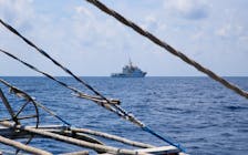 A China Coast Guard ship is seen from a Philippine fishing boat at the disputed Scarborough Shoal April 6, 2017. Picture taken April 6, 2017.   