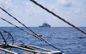 A China Coast Guard ship is seen from a Philippine fishing boat at the disputed Scarborough Shoal April 6, 2017. Picture taken April 6, 2017.   