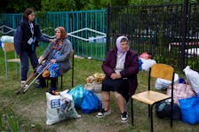 Vovchansk area residents, who fled due to Russian military strikes, wait at an evacuation centre compound, amid Russia's attack on Ukraine, in Kharkiv region, Ukraine May 14, 2024.