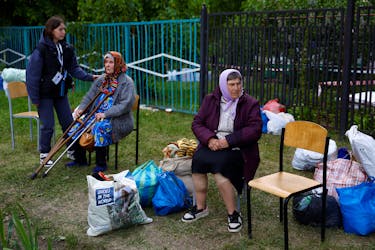 Vovchansk area residents, who fled due to Russian military strikes, wait at an evacuation centre compound, amid Russia's attack on Ukraine, in Kharkiv region, Ukraine May 14, 2024.