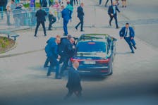 Security officers move Slovak PM Robert Fico in a car after he was injured in a shooting incident, after a Slovak government meeting in Handlova, Slovakia, May 15, 2024.