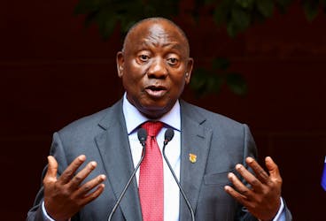 South Africa's President Cyril Ramaphosa gestures ahead of signing into law a national health bill that aims to provide universal coverage to South Africans, at the Union Building in Pretoria, South Africa, May 15, 2024.