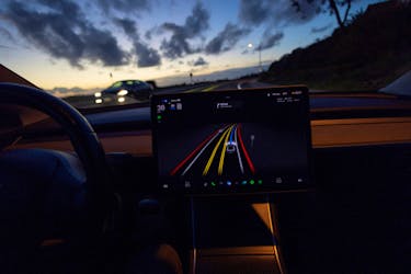 A Tesla Model 3 vehicle is shown using the Full Self Driving Beta software (FSD) while navigating a city road in Encinitas, California, U.S., February 28, 2023.