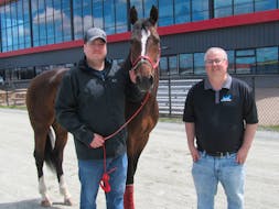 Horse owner and groom Corey Pickrem, left, is shown with the 2023 Claimer of the year ‘Boys Turn,’ standing nearby is Truro Raceway General Manager Steve Fitzsimmons.