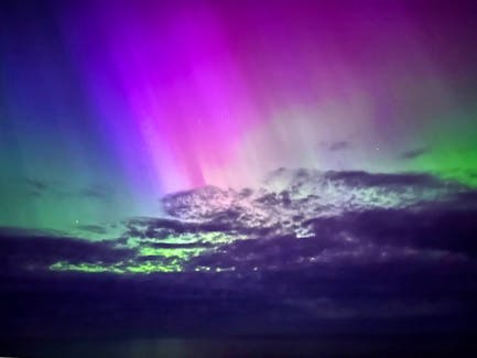 The northern lights filled much of the night sky over the Bruce Peninsula in Ontario on May 10, drawing people out to see and record the spectacle.