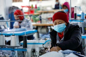 Labourers work at a private garment factory in Hanoi, Vietnam January 8, 2021.