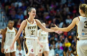 May 14, 2024; Uncasville, Connecticut, USA; Indiana Fever guard Caitlin Clark (22) reacts with guard Kristy Wallace (3) during a break in the action against the Connecticut Sun in the second half at Mohegan Sun Arena. Mandatory Credit: David Butler II-USA TODAY Sports