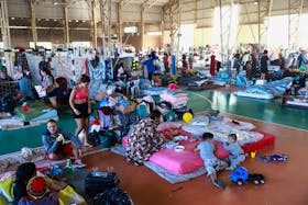 People who have been evacuated from flooded areas rest in a shelter at a university in Canoas, Rio Grande do Sul state, Brazil May 9, 2024.