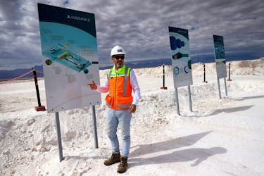 Albemarle's Chile country manager Ignacio Mehech shows an illustration of brines purification process to obtain lithium carbonate at their lithium plant placed on the Atacama salt flat, Chile, May 4, 2023.