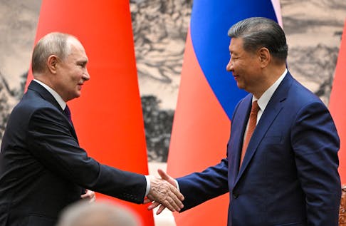 Russian President Vladimir Putin shakes hands with Chinese President Xi Jinping during a meeting in Beijing, China May 16, 2024.  Sputnik/Sergei Guneev/Pool via REUTERS