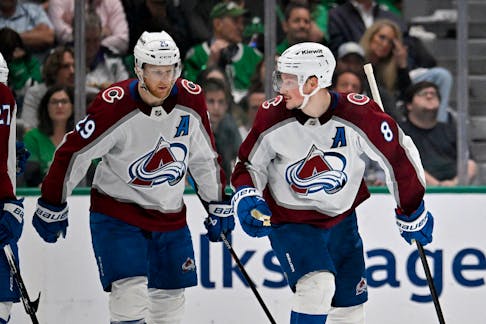 Colorado Avalanche centre Nathan MacKinnon (29) and defenceman Cale Makar (8) skate off the ice after Makar scores a power play goal against the Dallas Stars during the second period in game five of the second round of the 2024 Stanley Cup Playoffs at American Airlines Center in Dallas, Tex., on Wednesday, May  14, 2024. - Jerome Miron / USA TODAY Sports
