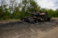 A destroyed tank is seen on a road, amid Russia's attack on Ukraine, in Kharkiv Region, Ukraine May 16, 2024.