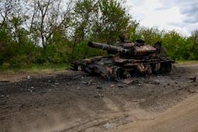 A destroyed tank is seen on a road, amid Russia's attack on Ukraine, in Kharkiv Region, Ukraine May 16, 2024.