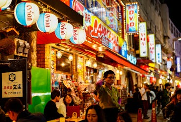 People enjoy drinks and food at izakaya pub restaurants at the Ameyoko shopping district, in Tokyo, Japan February 15, 2024.