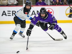 Toronto defenseman Kali Flanagan (6) trips Minnesota forward Denisa Krizova (41) in the first period in Game 3 of the Professional Women’s Hockey League semifinal series on Monday, May 13, 2024 in St. Paul, Minn.  