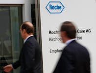 People enter  a factory of Swiss drugmaker Roche in Burgdorf near Bern November 17, 2010/File Photo