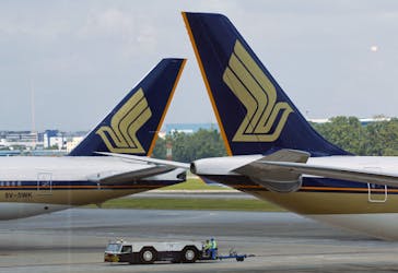 Singapore Airlines (SIA) planes sit on the tarmac in Singapore's Changi Airport March 3, 2016.