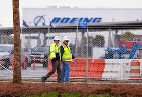 Workers walk through the Boeing South Carolina Plant while voting started on Wednesday whether the plant will be unionized in North Charleston, South Carolina, U.S. February 15, 2017. 