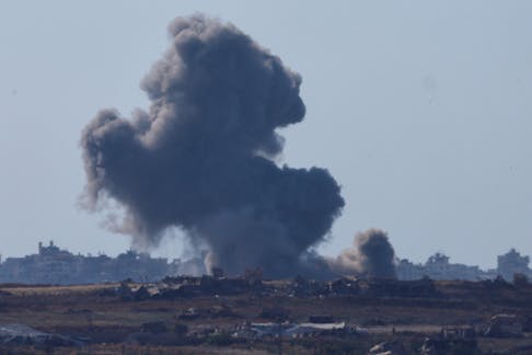 Smoke rises from an explosion following an Israeli airstrike in northern Gaza, near the Israel-Gaza border, amid the ongoing conflict between Israel and the Palestinian Islamist group Hamas, as seen from Israel, May 15, 2024.
