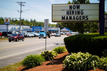 The sign on a Taco Bell restaurant advertises "Now Hiring Managers" in Fitchburg, Massachusetts, U.S., June 12, 2018.  