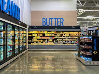 View of an aisle with new signage at Walmart's newly remodeled Supercenter, in Teterboro, New Jersey, U.S., June 7, 2023.