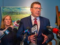 Saskatchewan Premier Scott Moe, right, speaks to members of media as Minister of Advanced Education Colleen Young, left, looks on in Regina on Friday, May 17, 2024.