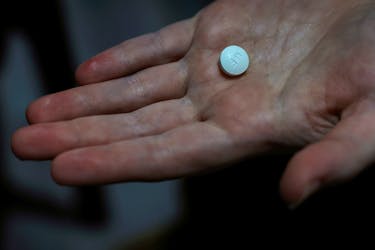A patient prepares to take Mifepristone, the first pill in a medical abortion, at Alamo Women's Clinic in Carbondale, Illinois, U.S., April 9, 2024.