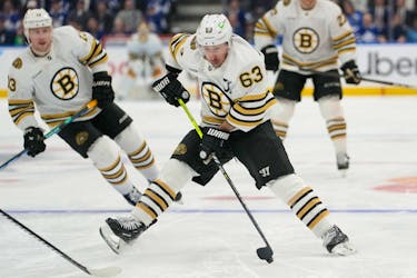 Apr 24, 2024; Toronto, Ontario, CAN; Boston Bruins forward Brad Marchand (63) carries the puck against the Toronto Maple Leafs during the second period of game three of the first round of the 2024 Stanley Cup Playoffs at Scotiabank Arena. Mandatory Credit: John E. Sokolowski-USA TODAY Sports