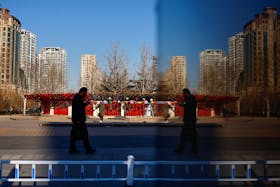 A person walks on a street in Beijing, China February 3, 2023.