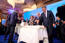 Andrej Plenkovic,  Prime Minister of Croatia, splits a cake following the preliminary results of the country's parliamentary election, in Zagreb, Croatia, April 18, 2024. 