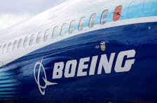 The Boeing logo is seen on the side of a Boeing 737 MAX at the Farnborough International Airshow, in Farnborough, Britain, July 20, 2022. 