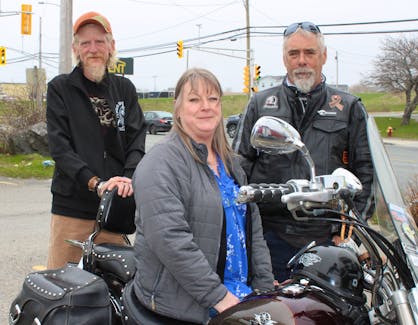 Crystal English, Mike Basso, right, and Howard Mugridge are organizers of the annual motorcycle ride to remember their friend Brian Douma. The ride takes place on Kellys Mountain on Victoria Day, May 20. BARB SWEET/CAPE BRETON POST