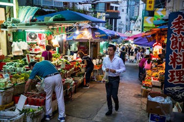 A man walks through a food market in an alley in Sheung Wan in Hong Kong, China November 6, 2019. 