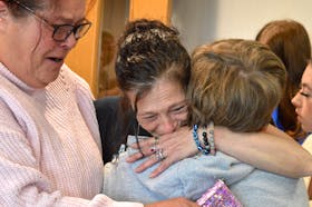 Susan Arsenault, the mother of Talia Forrest, was overwhelmed by emotion as she embraced family members outside the courtroom after Colin Tweedie was found guilty on three charges in relation to her 10-year-old daughter’s hit-and-run death. Chris Connors/Cape Breton Post