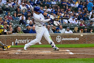 May 16, 2024; Chicago, Illinois, USA;  Chicago Cubs outfielder Seiya Suzuki (27) singles during the first inning against the Pittsburgh Pirates at Wrigley Field. Mandatory Credit: Matt Marton-USA TODAY Sports