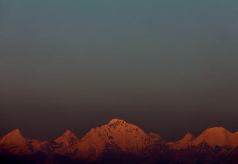 Mount Everest, the world's highest mountain, and other peaks of the Himalayan range are seen during sunset from Kathmandu, Nepal October 17, 2022.