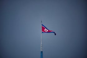 A North Korean flag flutters at the propaganda village of Gijungdong in North Korea, in this picture taken near the truce village of Panmunjom inside the demilitarized zone (DMZ) separating the two Koreas, South Korea, July 19, 2022.   
