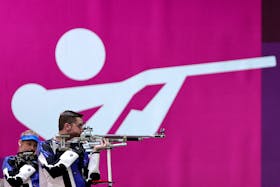 Tokyo 2020 Olympics - Shooting - Mixed 10m Air Rifle Team - Qualification - Asaka Shooting Range, Tokyo, Japan - July 27, 2021. William Shaner of the United States and Alison Weisz of the United States in action