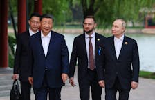 Russian President Vladimir Putin and Chinese President Xi Jinping walk to attend a tea ceremony in Beijing's Zhongnanhai park, China May 16, 2024. Sputnik/Mikhail Metzel/Pool via REUTERS