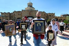 People take part in a procession, that was organized by the Patriarchate of Georgia's Orthodox Church to mark the Day of Family Purity and Respect for Parents, in Tbilisi, Georgia, May 17, 2024.