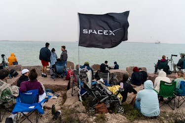 Spectators gather on South Padre Island to watch the planned launch of SpaceX's next-generation Starship spacecraft from the company's Boca Chica launchpad, near Brownsville, Texas, U.S. March 14, 2024.