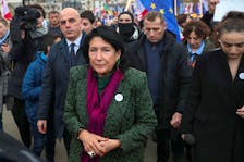 Participants, including Georgia's President Salome Zourabichvili, walk during a procession in support of the country's membership in the European Union, in Tbilisi, Georgia, December 9, 2023.