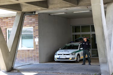 A police officer stands next to a police vehicle parked outside F.D. Roosevelt University Hospital where Slovak Prime Minister Robert Fico was taken after a shooting incident in Handlova, in Banska Bystrica, Slovakia, May 18, 2024.