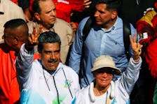Venezuela's President Nicolas Maduro and his wife Cilia Flores participate in a rally during May Day celebrations in Caracas, Venezuela May 1, 2024.