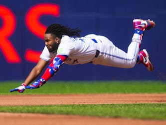 Vladimir Guerrero Jr. of the Toronto Blue Jays slides into second base on a double against the Tampa Bay Rays on Saturday. 
