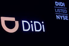 A screen displays trading information for ride-hailing giant Didi Global on the floor of the New York Stock Exchange (NYSE) in New York City, U.S., December 3, 2021. 