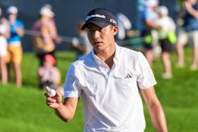 May 18, 2024; Louisville, Kentucky, USA; Collin Morikawa waves to the fans after making his putt on the 18th hole during the third round of the PGA Championship golf tournament at Valhalla Golf Club. Mandatory Credit: Clare Grant-USA TODAY Sports/File Photo
